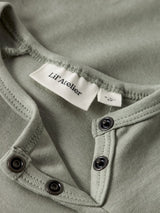 Lil' Atelier Baby Lalo Tab romper Seagrass