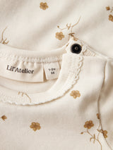 Lil' Atelier Baby Flayo Sig romper Coconut Milk FLOWER YELLOW